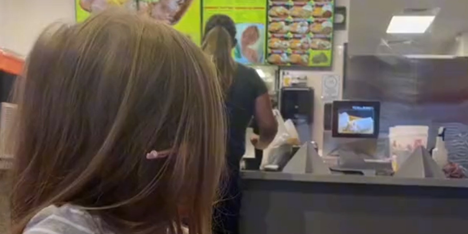 young girl reacts to woman yelling at fast food counter