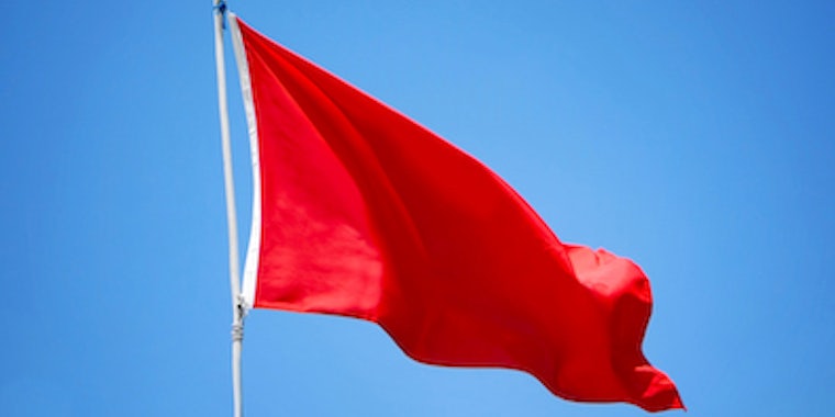 red flag blowing in the wind