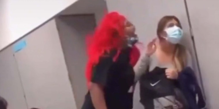 In a TikTok, a Houston middle school teacher is seen breathing on a student without her mask on.