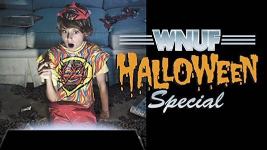 WNUF Halloween Special shudder - a scared woman sits on a sofa watching a TV special