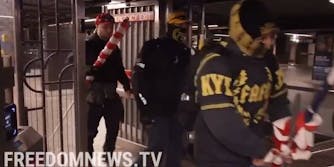 Proud Boys members seen walking through the emergency exit at NYC subway station