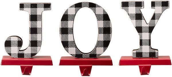 Black-and-white plaid stocking holders that say JOY