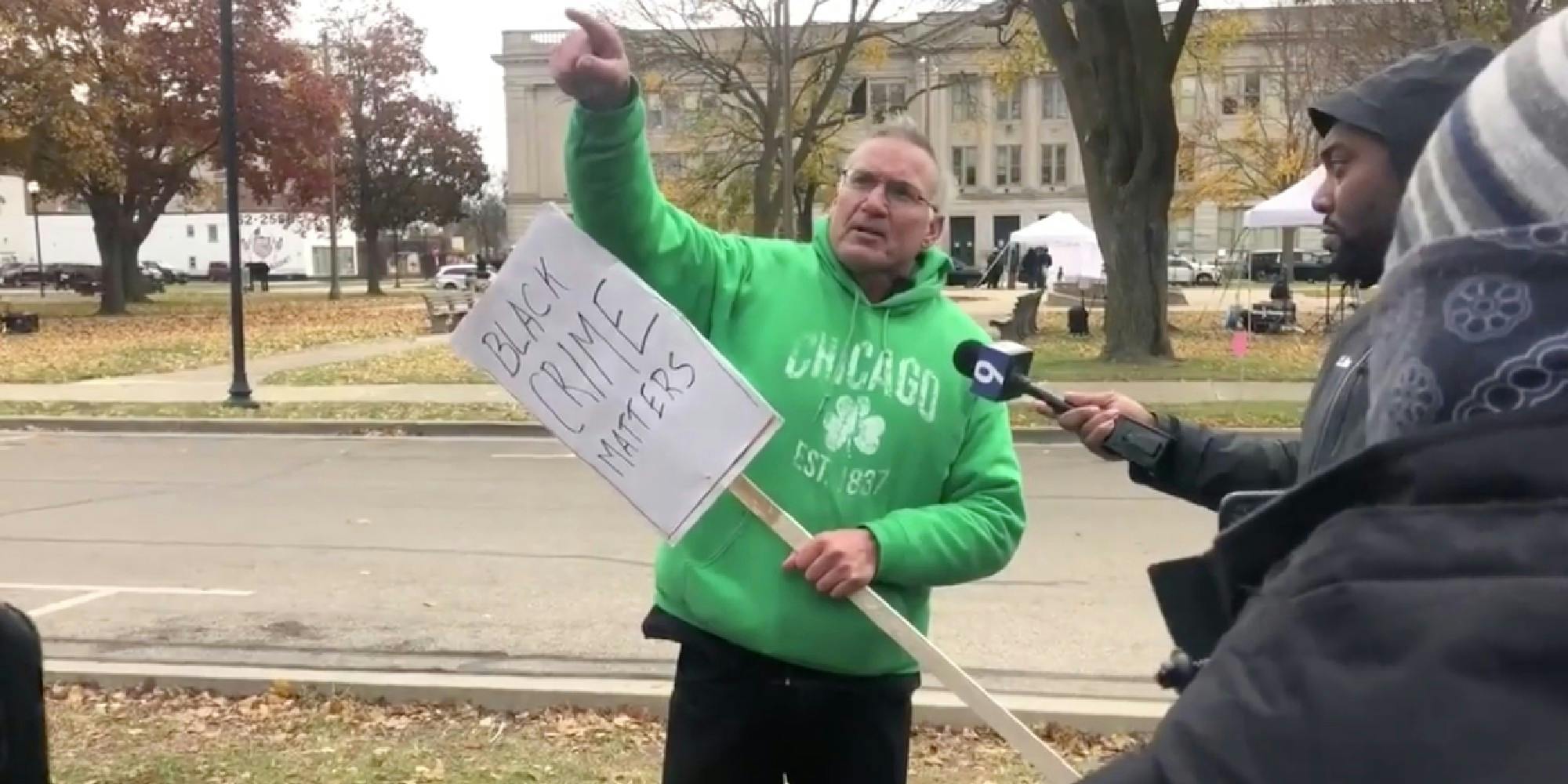 White man holds 'Black crime matters' sign outside of Kenosha County Courthouse