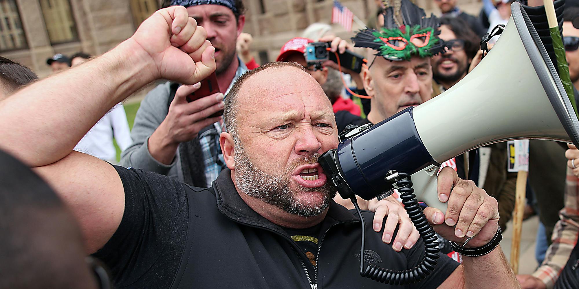 A man yelling into a megaphone.