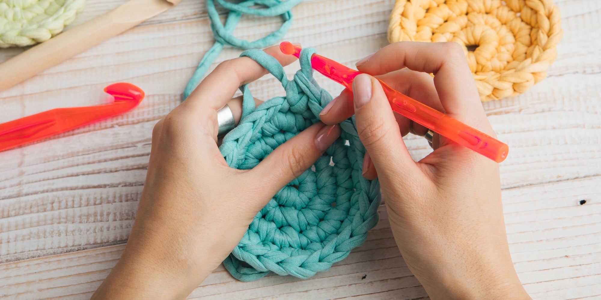 woman's hands crocheting