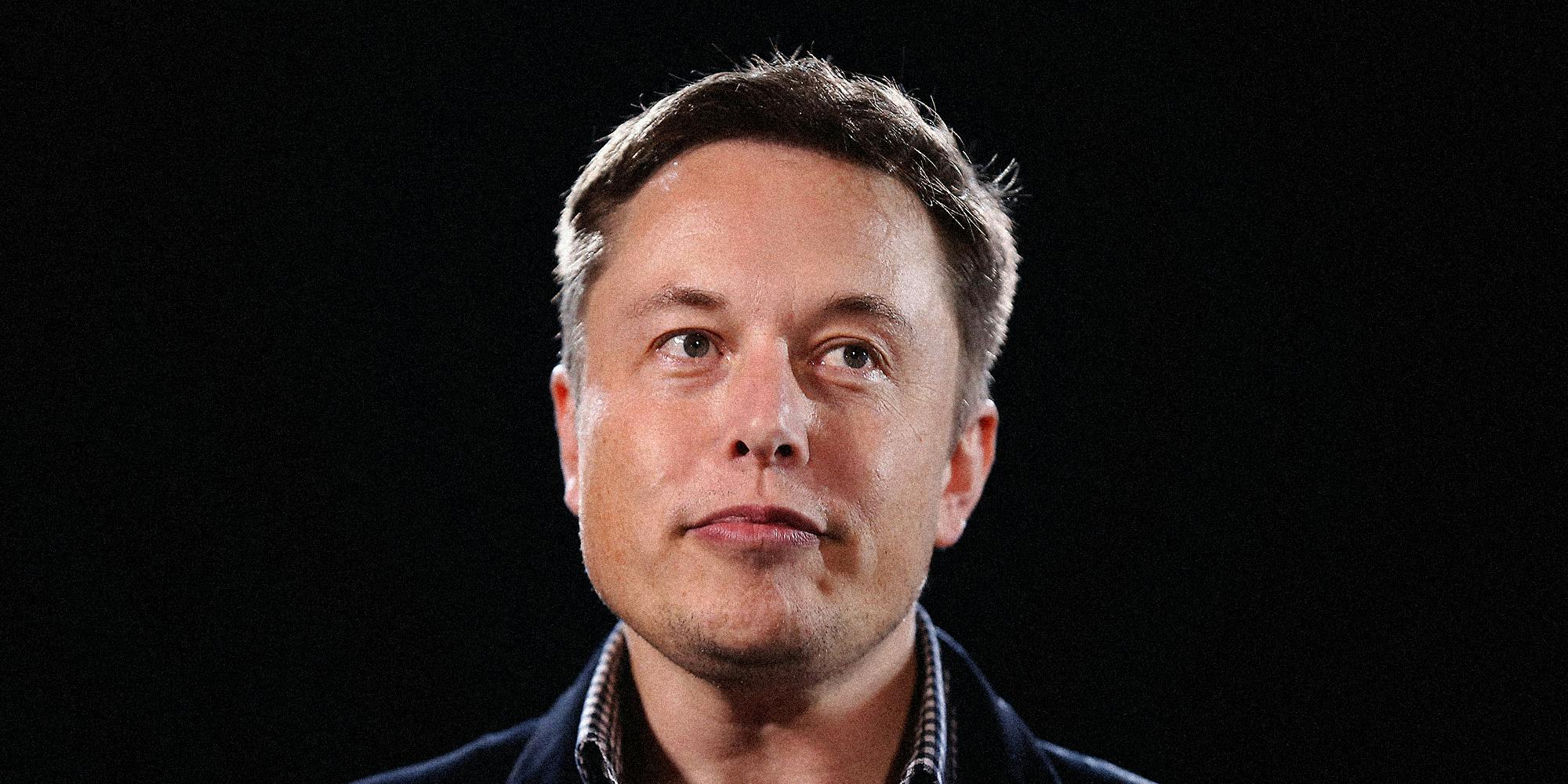 Elon Musk looking off camera.