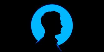 A man's silhouette in the Facebook blue.