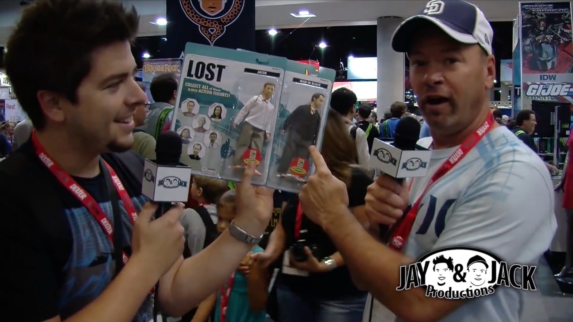 jay glatfelter (left) holding action figures as jack glatfelter (right) points to one at sdcc