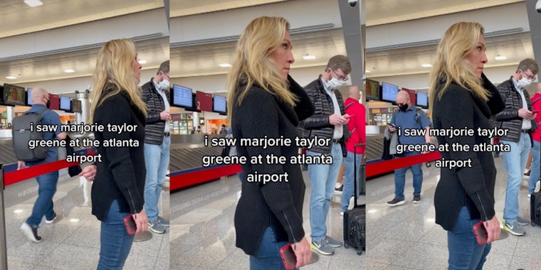 A woman standing inside an airport