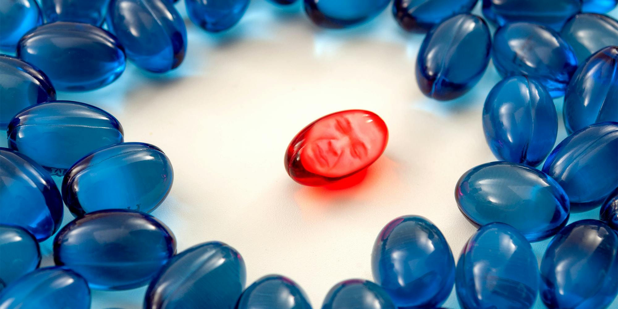 Kyle Rittenhouse crying as red pill in the center of blue pills