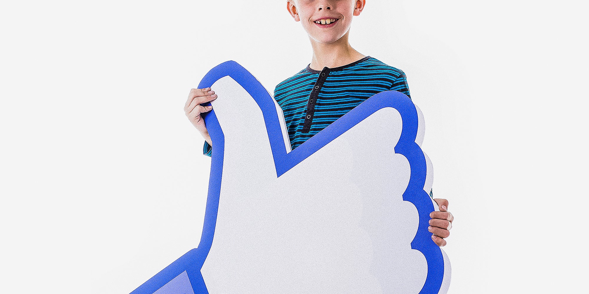 A child holding up a paper hand.