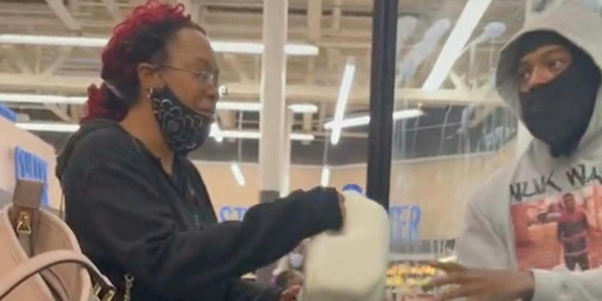 At an understaffed grocery store, customers retrieve milk from the freezer themselves.