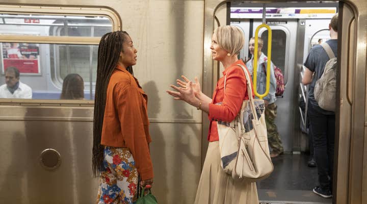 two women outside a subway car