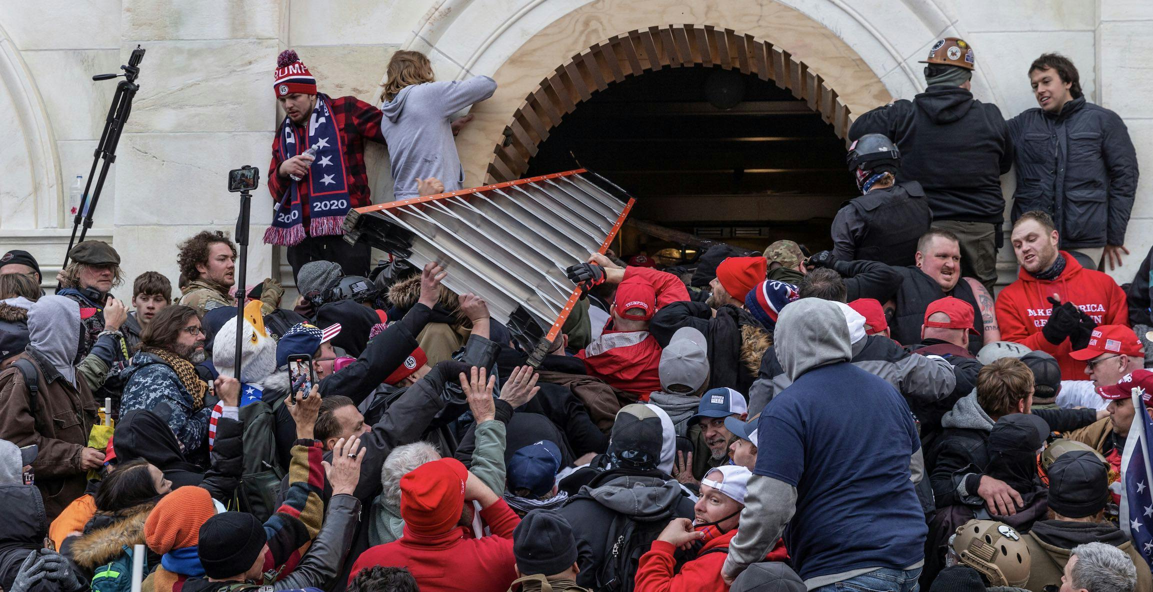rioters attempting to break into the capito
