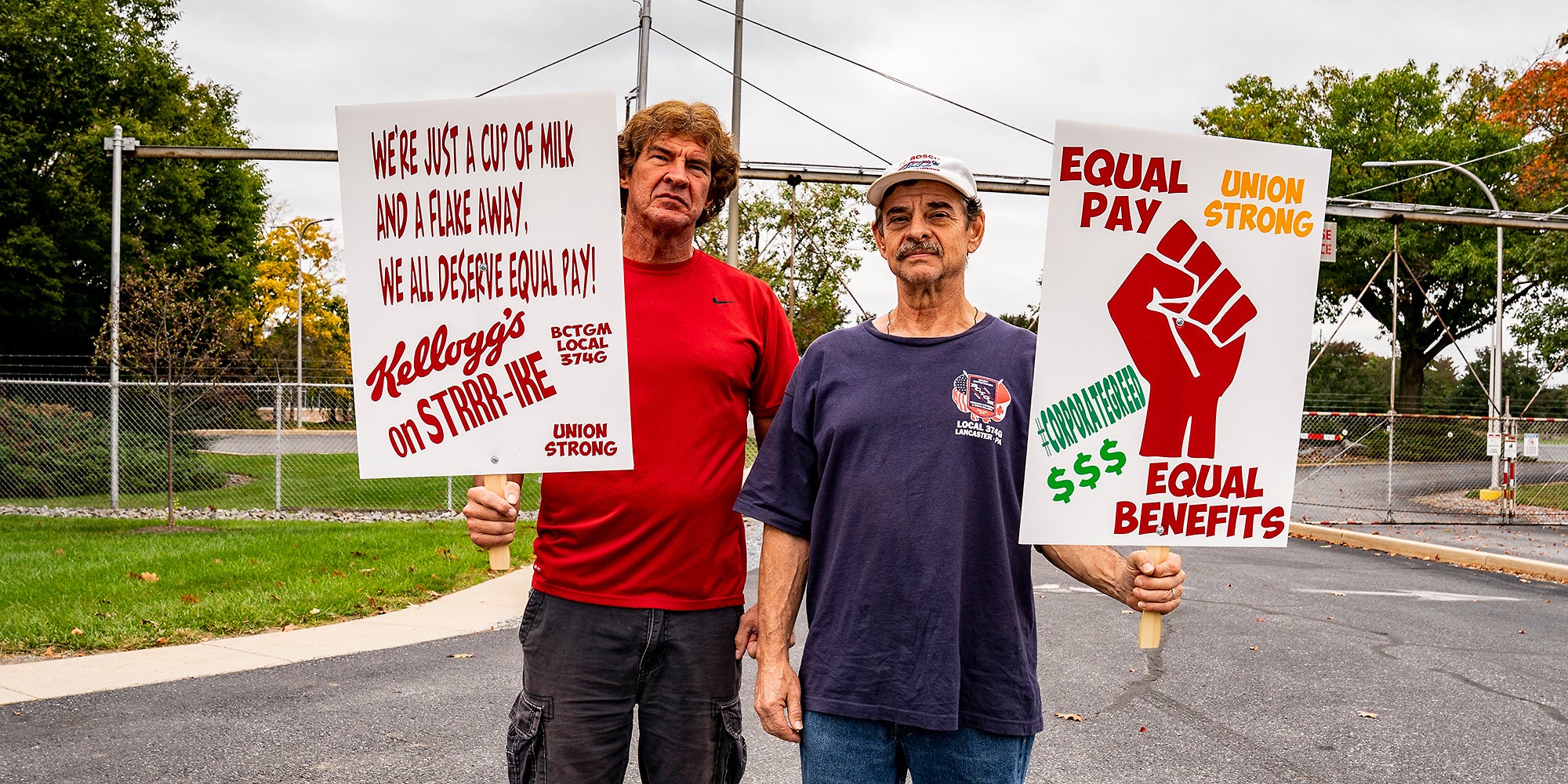 Two men with protest signs.