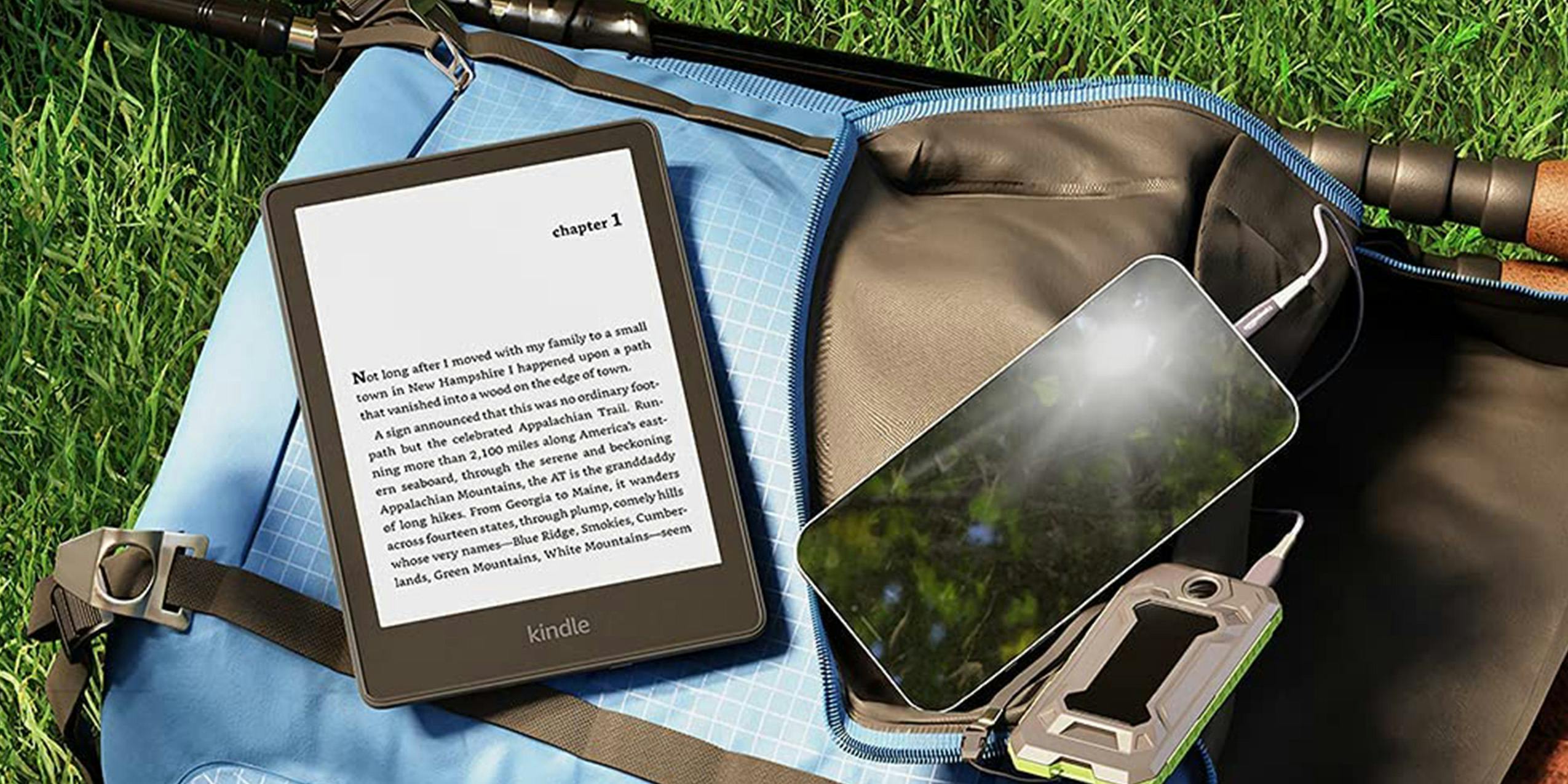 A Kindle Paperwhite used outside.