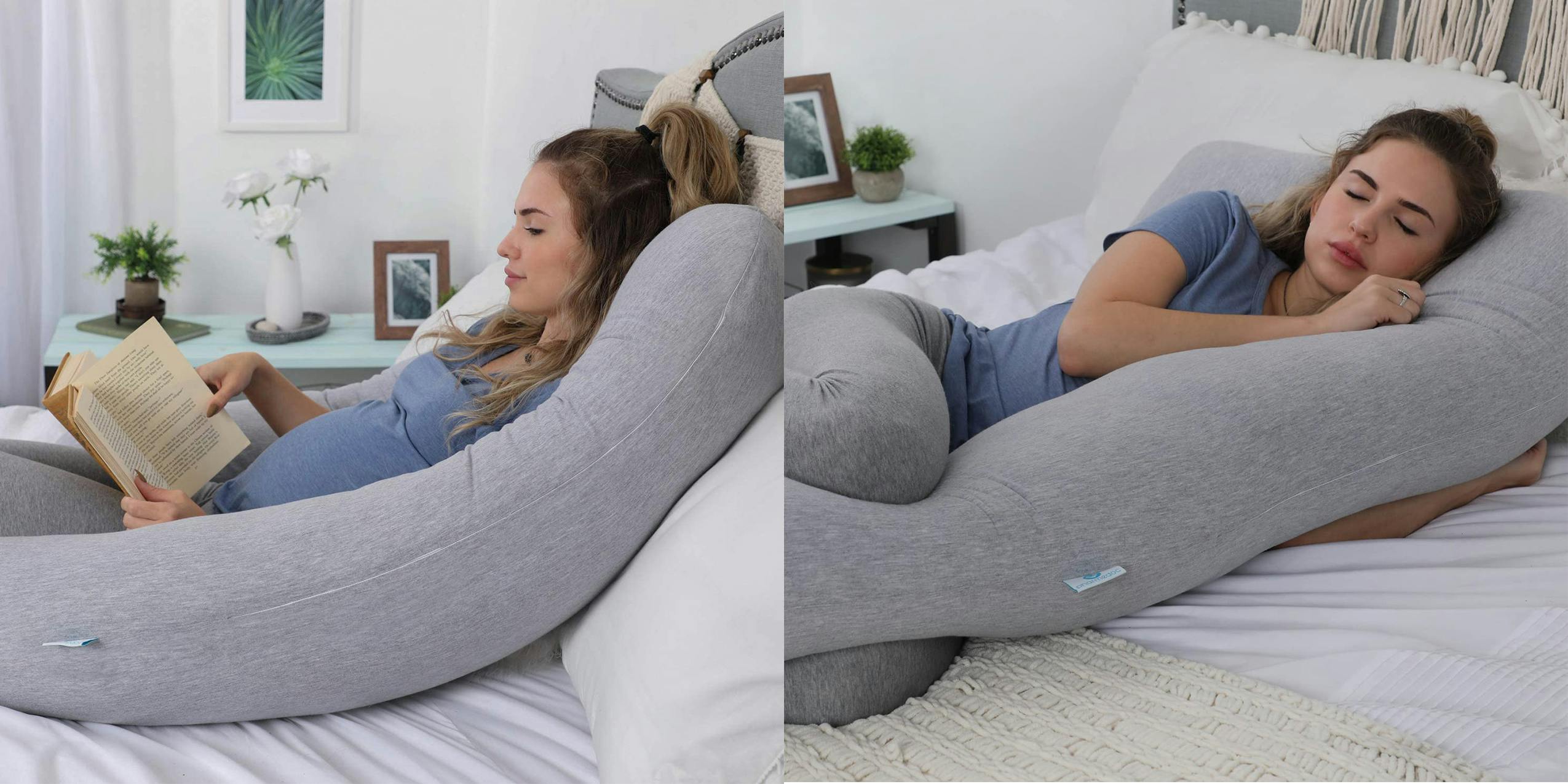 A woman laying on a pregnancy pillow reading and sleeping.
