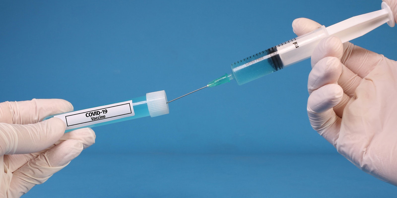 The COVID-19 vaccine being put into a syringe.