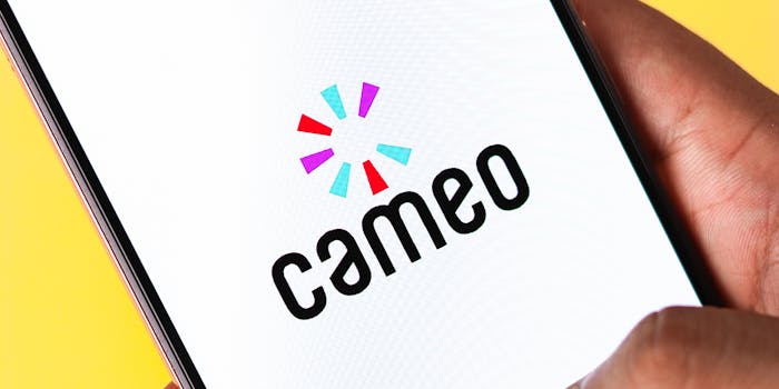 hand holding phone with cameo logo