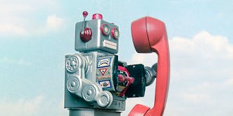 A robot with a telephone.