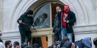 Pro-Trump protesters seen inside Capitol building as they enter in through broken windows