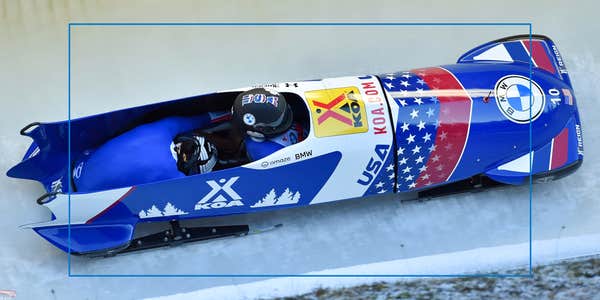 Bobsled team with USA on helmet