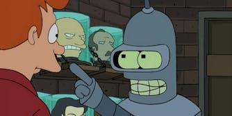 bender the robot pointing at fry the delivery boy in a cell filled with heads in jars