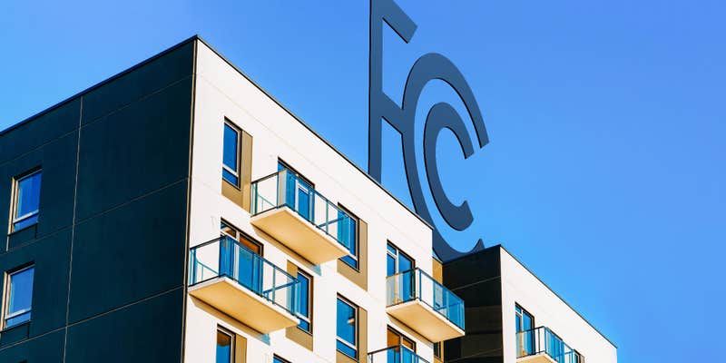 apartment buildings with the FCC logo on top of them