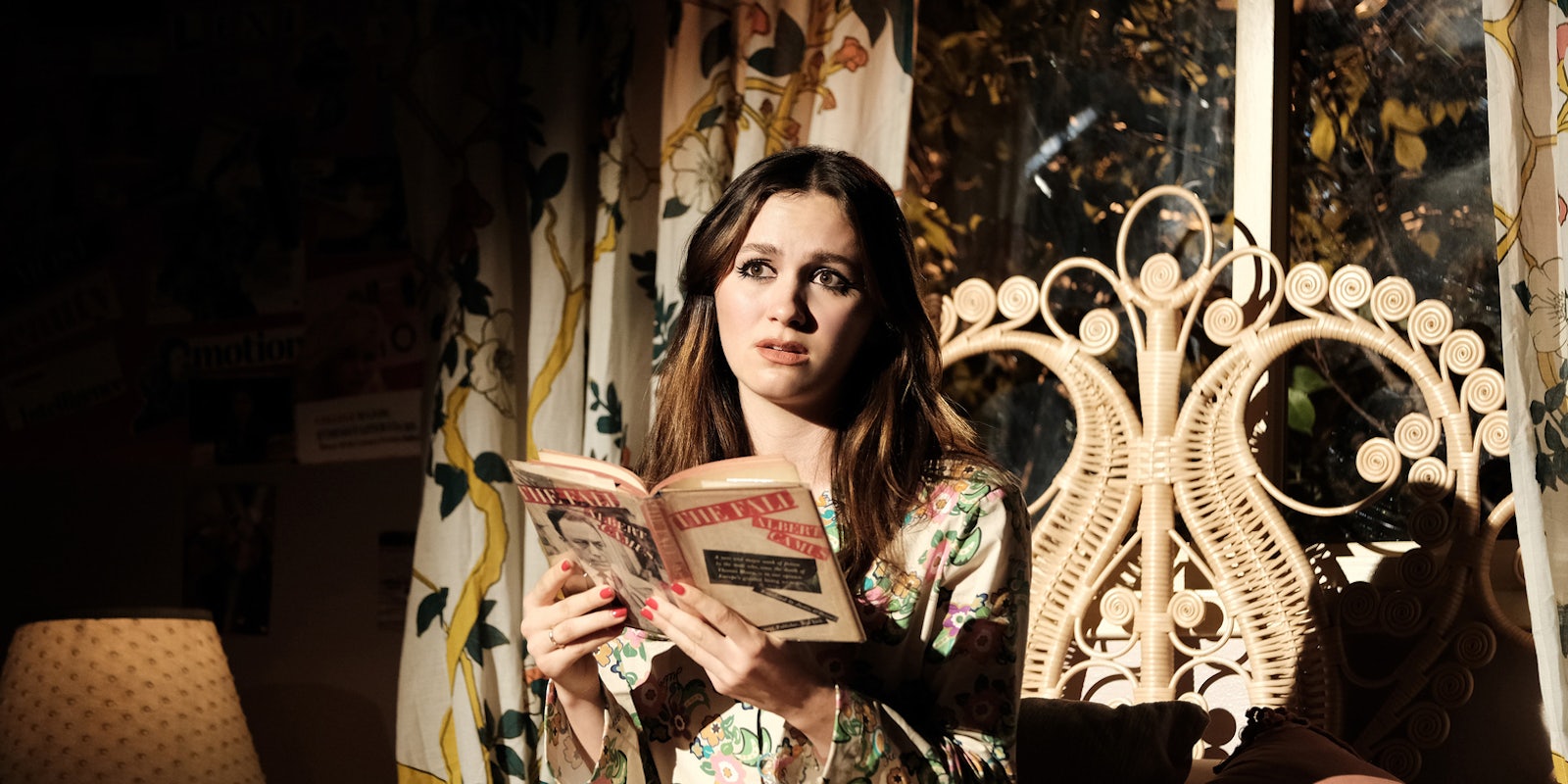 maude apatow reading a book on a bed in a scene from the tv show euphoria