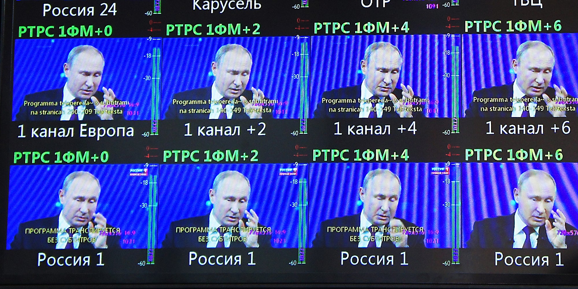 Putin on multiple TV screens.