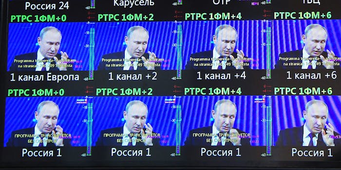 Putin on multiple TV screens.