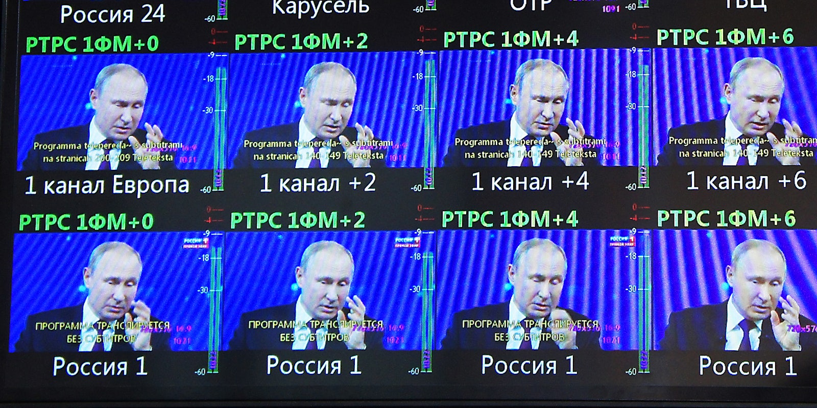Putin on multiple TV screens.