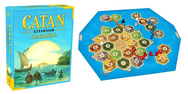 Settlers of Catan expansion pack Seafarers alongside game board and pieces
