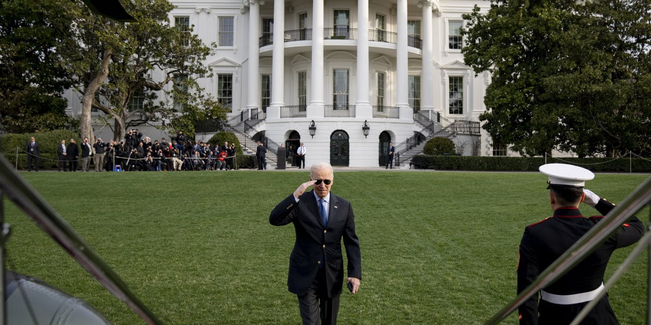 Joe Biden saluting near the White House.