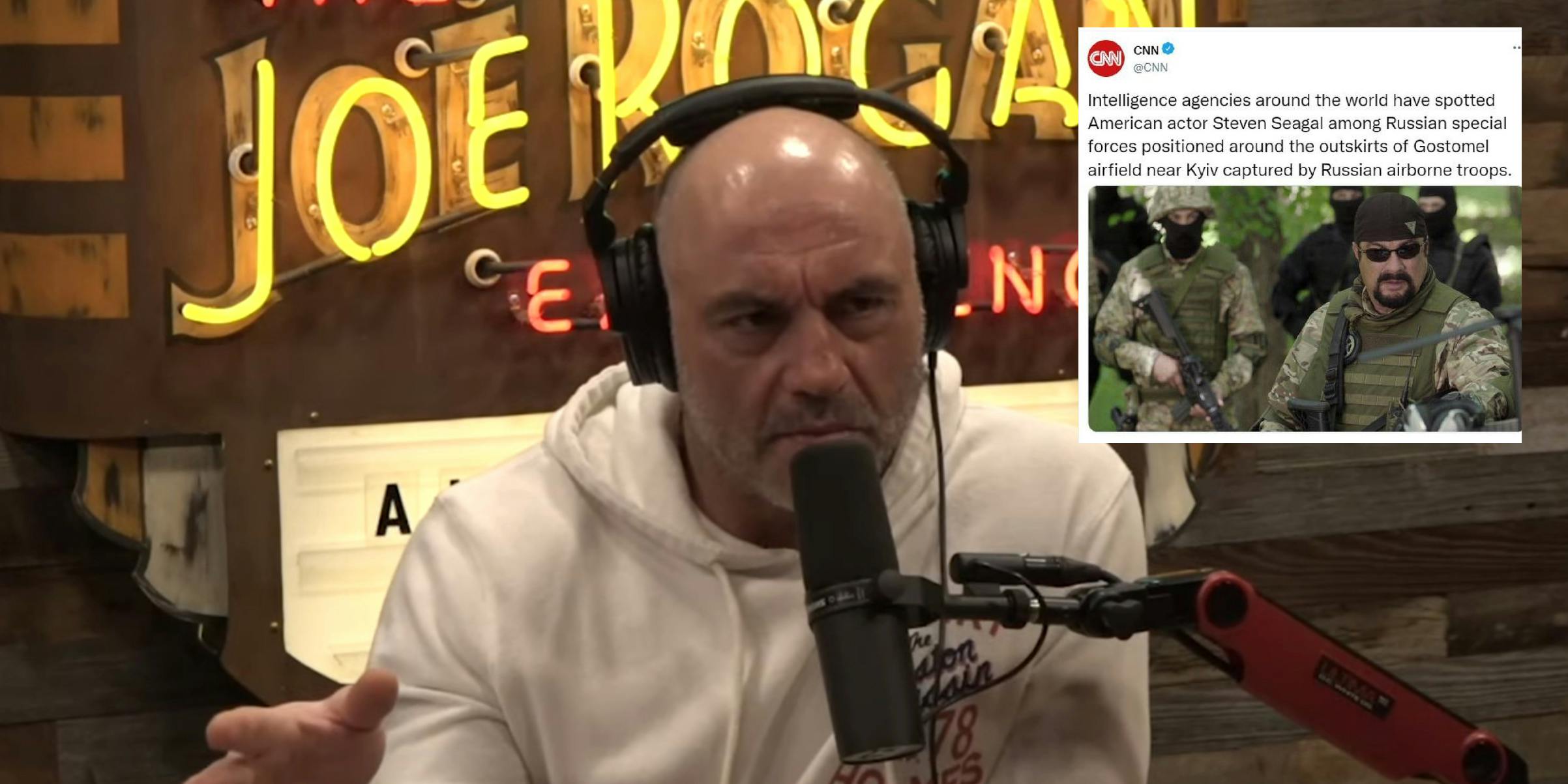Joe Rogan talking on his podcast. Next to him is a screenshot of a fake CNN tweet that he shared saying Steven Seagal was among Russian special forces in Ukraine.