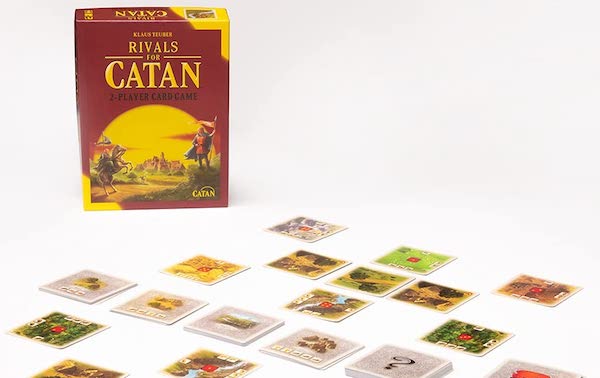 Rivals of Catan box with cards spread out for play