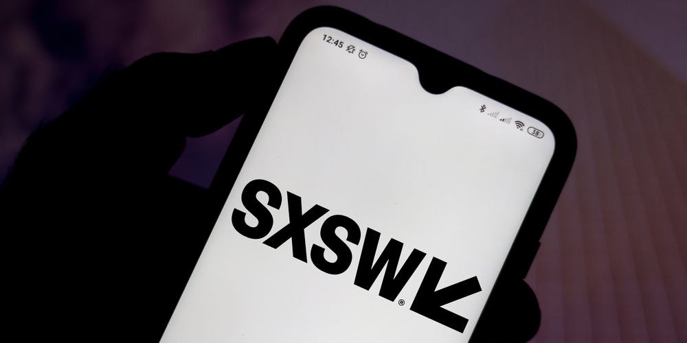 In this photo illustration the South by Southwest (SXSW) logo seen displayed on a smartphone screen