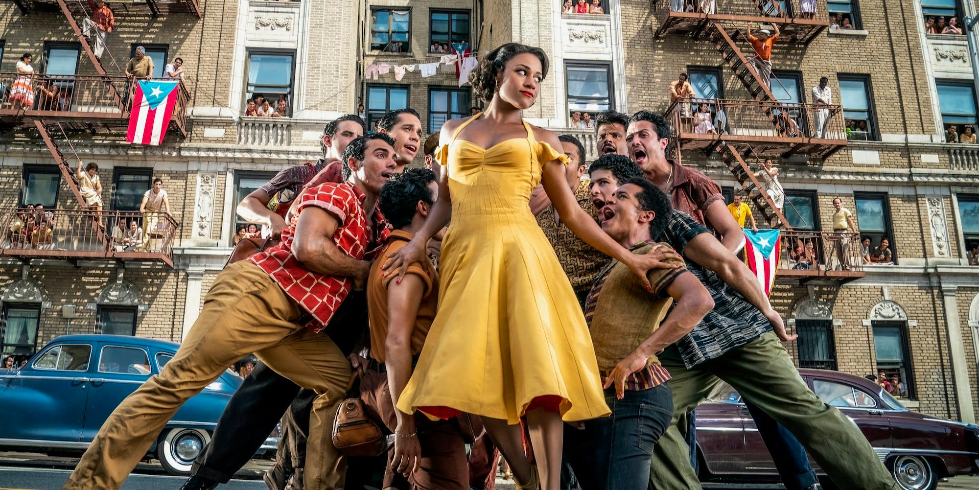 ariana debose (center) surrounded by a group of performers in west side story