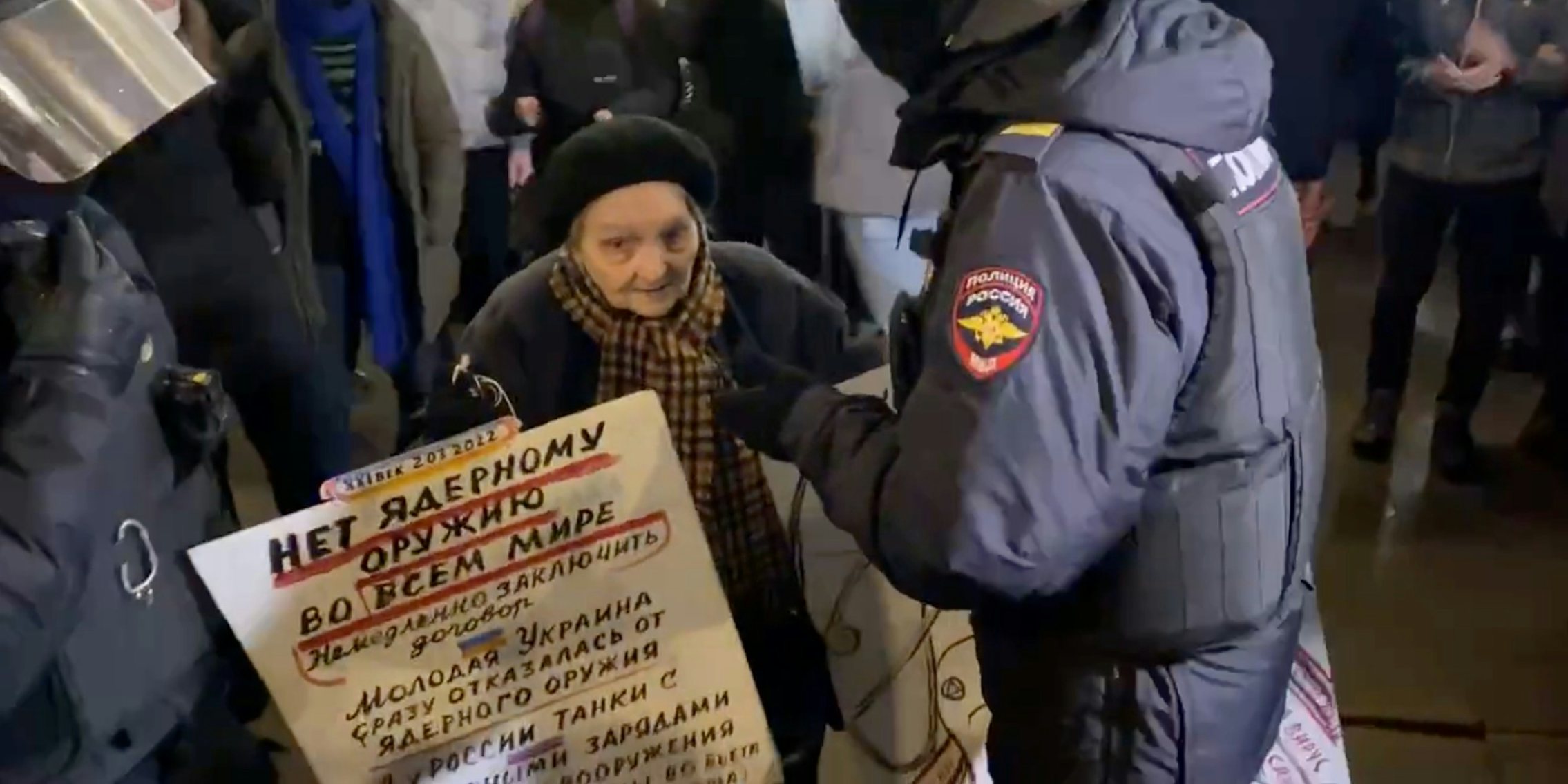An elderly Russian woman confronted by police