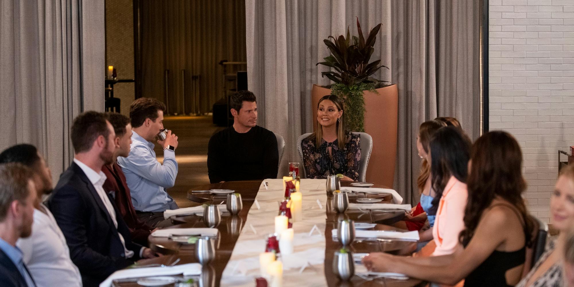 A group of people sitting around a table for dinner on the Netflix show The Ultimatum: Marry or Move On