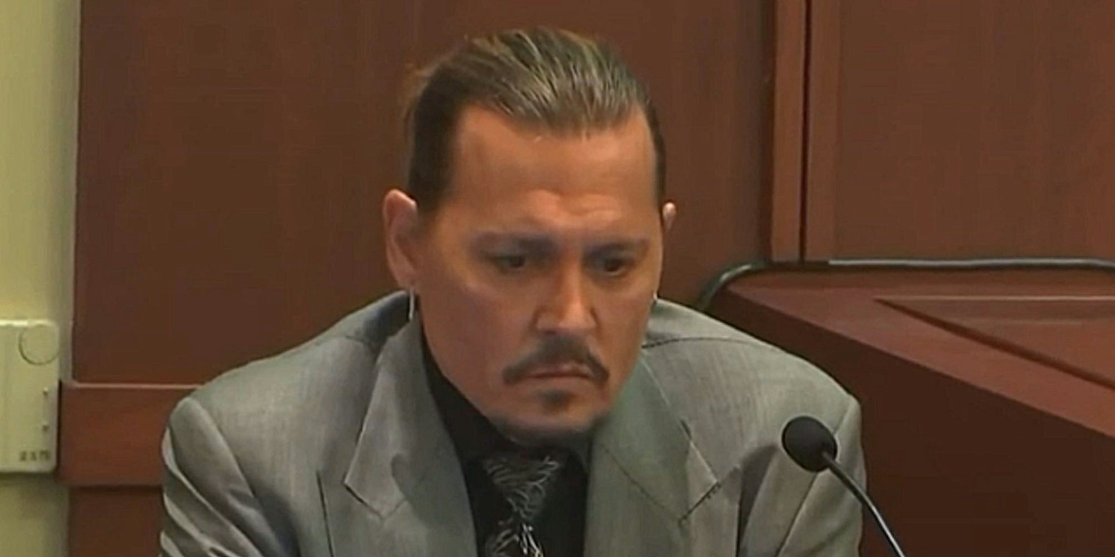 Johnny Depp face after hearing Amber Heard tape in court