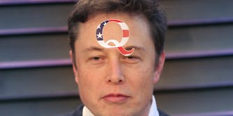 elon musk with a qanon sticker on his forehead