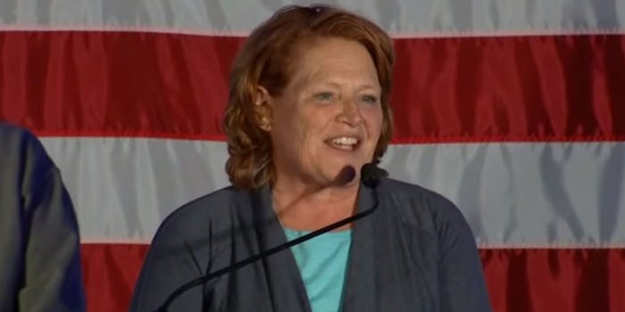Former Senator Heidi Heitkamp speaking into microphone
