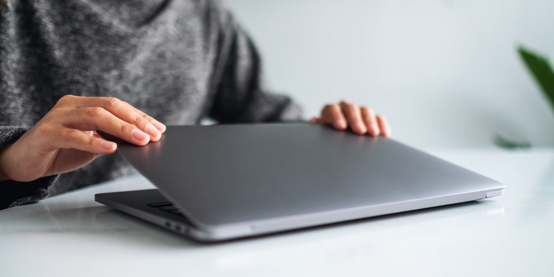 woman closing laptop