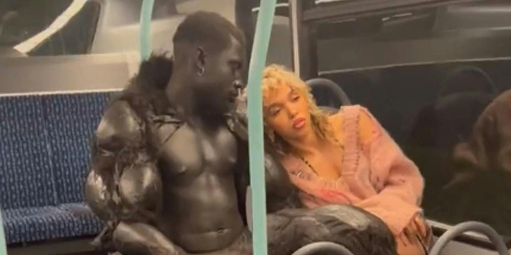 FKA Twigs in seat with shirtless man