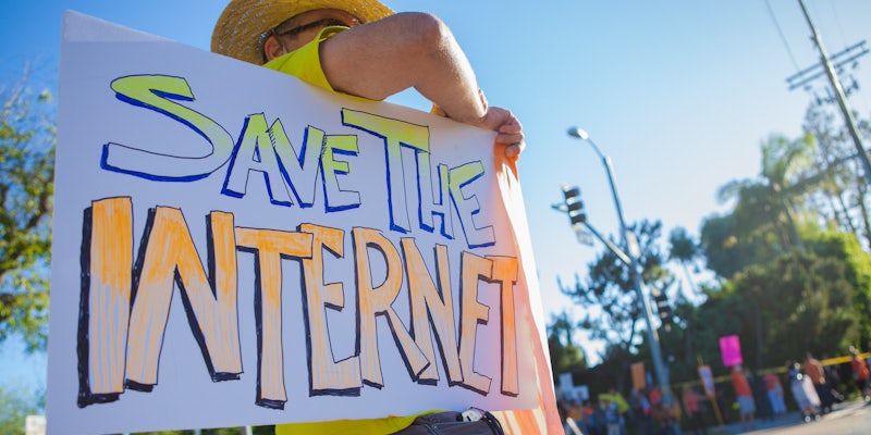 A person supporting net neutrality with a sign that says 'Save the Internet.'