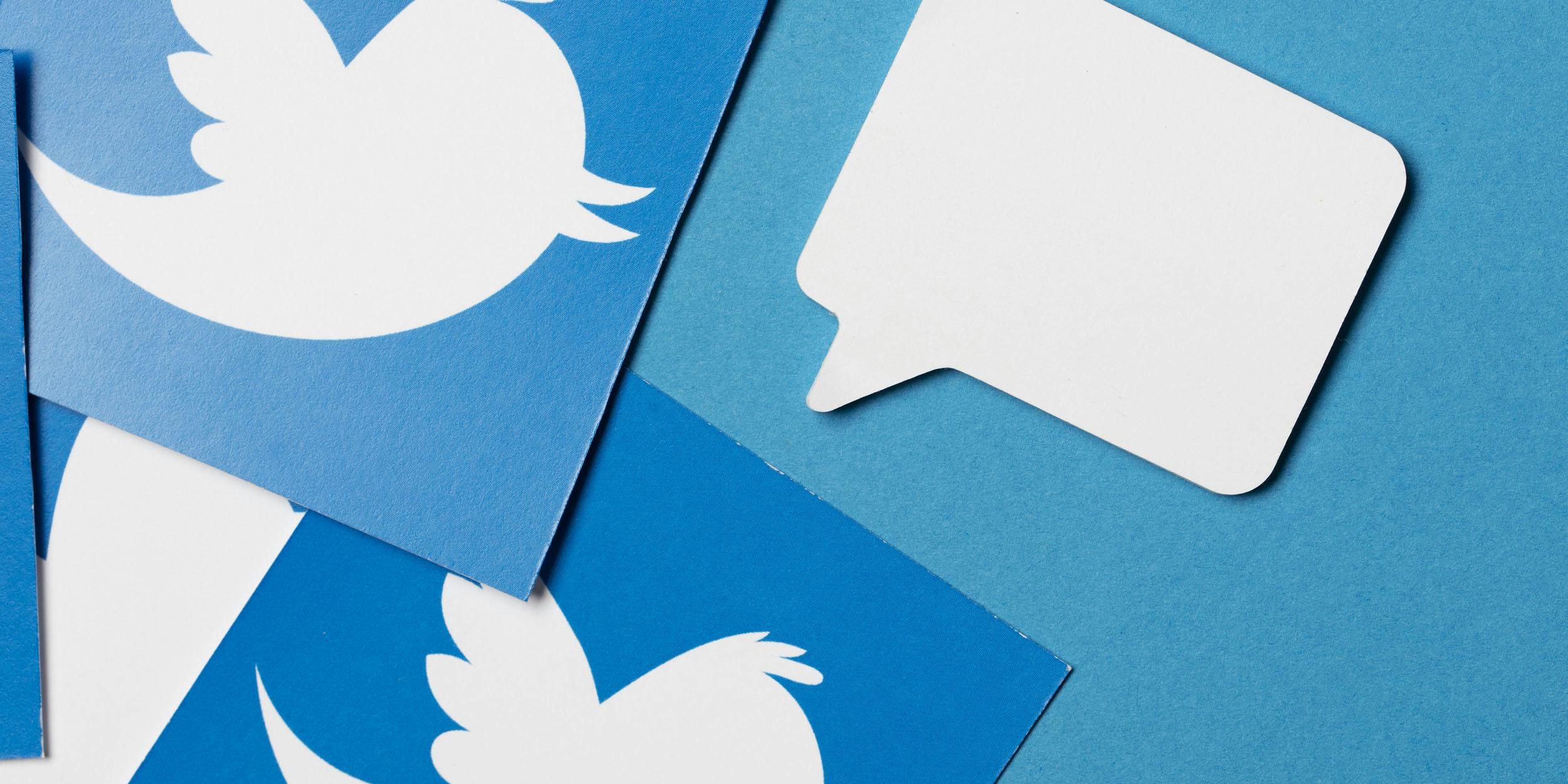 Logos of Twitter and a speech bubble for the Daily Dot newsletter.