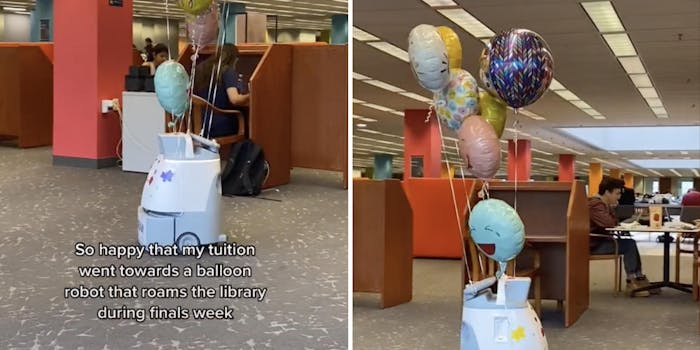 robot on wheels with balloons tied to it driving around a library