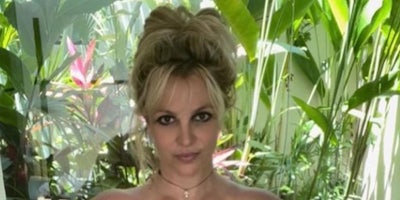 Britney Spears photo from shoulders up nature behind her