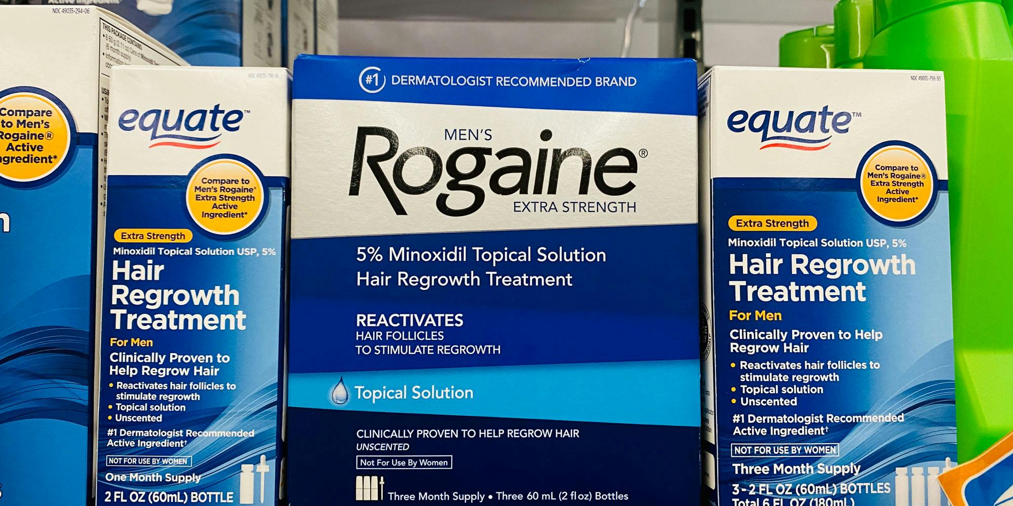 Items on store shelf, hair growth treatments with Rogaine extra strength in the middle (name brand)